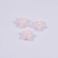 Three pink pentagon star resin opal beads with iridescent sequins on white background - Pink