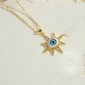 Golden sunburst necklace with evil eye pendant and zircon stones on a cross chain - Sunburst Pendant