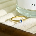 Minimalist 18K gold plated stainless steel ring featuring a round blue birthstone - March - Light Blue (Aquamarine)