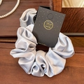 Elegant silver-gray satin scrunchie with lace trim on a handmade display card - Rose Satin Marine Blue