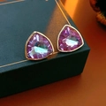 Macro shot of triangle-cut purple crystal earrings with gold trim on jewelry box - Style 3 Silver Pin Rhinestone Triangle Stud Earrings