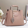 Elegant dusty rose faux leather shoulder bag with lychee texture and leaf pendant charm - Apricot