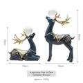 Deep blue and gold deer figurines with transparent spheres for home decor - Antique Bronze Style Deer Pair