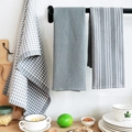 Close-up of grey waffle weave and striped cotton kitchen towels hanging on a rack - Grey Tea Towel 3-Piece Set / 45*65cm
