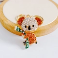 Detailed view of koala keychain with white and orange rhinestones on gold alloy base - Pendant Only / Gold