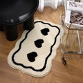 Irregular black and white heart patterned plush bath mat on wooden floor with modern chair - 40x60cm / Heart-White
