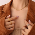 Golden chain necklace with interlinked rings and mixed gold-silver stacked rings set - Gold Interlocking Geometric Necklace