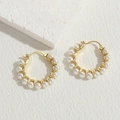 Minimalist pearl hoop earrings featuring gold plating and elegant white round pearls - Gold