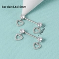 Macro view of silver heart-shaped nipple rings with zircon charms and sizing detail - Hollow Dangle