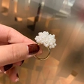 Chic golden ring with delicate white pearls cluster on a hand with red nails - Pearl Flower Ring