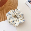 Floral scrunchie in off-white with blue tulip print and yellow floral details - Tulip Blue