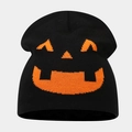 Close-up of knit texture and orange jack-o'-lantern pattern on a black beanie - Style D Black+Orange (Jack-O-Lantern Face)