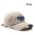 Beige cotton baseball cap with embroidered Canada Niagara Falls text and adjustable strap - Beige