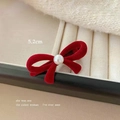 Close-up of a 5.2cm red velvet bow hair clip featuring a white pearl on a display tray - Red Pearl Bowknot