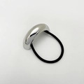 Detail of minimalist silver alloy hair tie with sleek metal arc and black elastic band - Eco-friendly Style B Silver