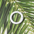 Detailed view of a white 23mm round metal spring ring buckle on a palm leaf background - White (Outer Diameter 23mm)