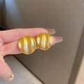 Vintage matte gold wave pattern round earrings held in hand for scale and texture - Silver Earring Post Wrinkled Pattern Circle Earrings