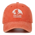 Close-up of orange washed cotton cap with Bigfoot Hide & Seek Champion embroidery - One Size / Orange