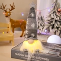 Luminous grey knitted Christmas gnome with snowflake patterns and star on a book - Grey Short Leg LED Doll