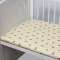 Fitted baby crib sheet in light yellow featuring brown cartoon dog prints and Lady logo - Dog / 120*60cm