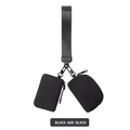 Detail of black waterproof nylon wrist bag featuring dual pouches and a wide woven strap - Black/Black
