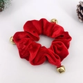Detail of red velvet Christmas scrunchie with golden bells on pine cone background - Triple Bell Christmas Scrunchie Red