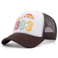 Vintage 1983 printed trucker hat in brown and white mesh shown at a 45-degree angle - Adjustable / Brown