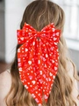 Red bow hair clip with heart prints and LOVE lettering, featuring long flowing ribbons - Streamer Clip Red Printed