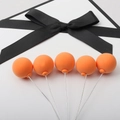 Five orange balloon cake toppers with black bows and wire stems for birthday party decor - Single Piece / Orange Single Ball