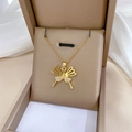Detailed close-up of a hollow butterfly necklace with white zircon in a jewelry box - Gold Butterfly Micro Inlaid Style (G301)