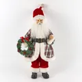 Standing Santa Claus figurine in red plaid coat holding a festive green berry wreath - Style 24 Scottish Plaid Coat Holding Wreath 45cm