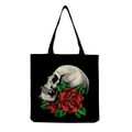 Detail showing the realistic white skull and red rose print on a black canvas tote bag - Gothic Style Side Skull and Red Roses (hm6642)