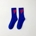 Royal blue mid-calf socks featuring a red heart pattern and soft knitted texture - Blue