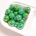Macro shot of 14mm aurora green UV-coated acrylic round beads for DIY jewelry making - Dark Green