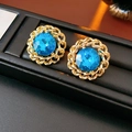 Macro shot of vintage gold chain earrings with deep blue gemstones on black velvet - 46# Silver Earring Post-Gold-Blue