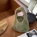 Handcrafted green cotton rope woven tote bag with hollow grid design on a wooden table - Army Green (with inner bag)