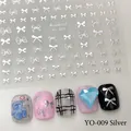 Silver bowknot nail stickers YO-009 featuring various hollow and solid ribbon designs - YO-009 Silver