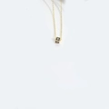 Minimalist square alphabet necklace with gold letter B pendant on a black surface - B