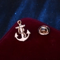 Classic golden anchor lapel pin on red velvet background with butterfly clutch back - Gold Anchor