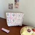 Pastel pink quilted cotton cosmetic bag with floral patterns and bow details - Patchwork Berry