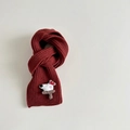 Detail of red cable knit scarf with 3D cartoon puppy patch and brown mushroom design - Burgundy