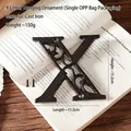 Vintage cast iron letter X wall plaque with screws on book for home and cafe decor - Letter X