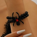 Gothic beaded bracelet with black spider charm and red gemstone accent on wrist - Red Ruby Black Spider Bracelet (3741)