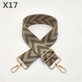 Close-up of high-density canvas bag strap with black and gray V-pattern and gold hooks - Dark Green