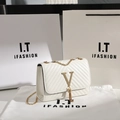 White quilted crossbody bag with golden V-logo tassel and elegant chain strap - White