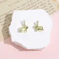 Golden rabbit charm for DIY jewelry, polished metal bunny pendant size 14x20mm - Squatting Rabbit / Gold