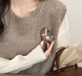 Macro shot of a dark brown fabric horse brooch pinned to a warm knitted sweater vest - 2# Coffee Cartoon Style / Brown