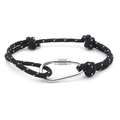 Detail of adjustable black woven rope bracelet featuring a polished silver carabiner clasp - No. 13 Black with White Dots