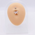 Detail view of a silver butterfly belly button ring with zircon on a silicone model - White Butterfly G