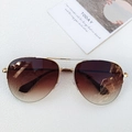 Lunettes aviateur classiques avec monture dorée et verres dégradés marron sur fond blanc - Monture Dorée Double Thé